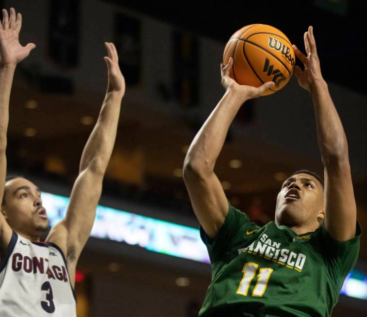 San Francisco Dons forward Patrick Tape (11) shoots over Gonzaga Bulldogs guard Andrew Nembhard ...