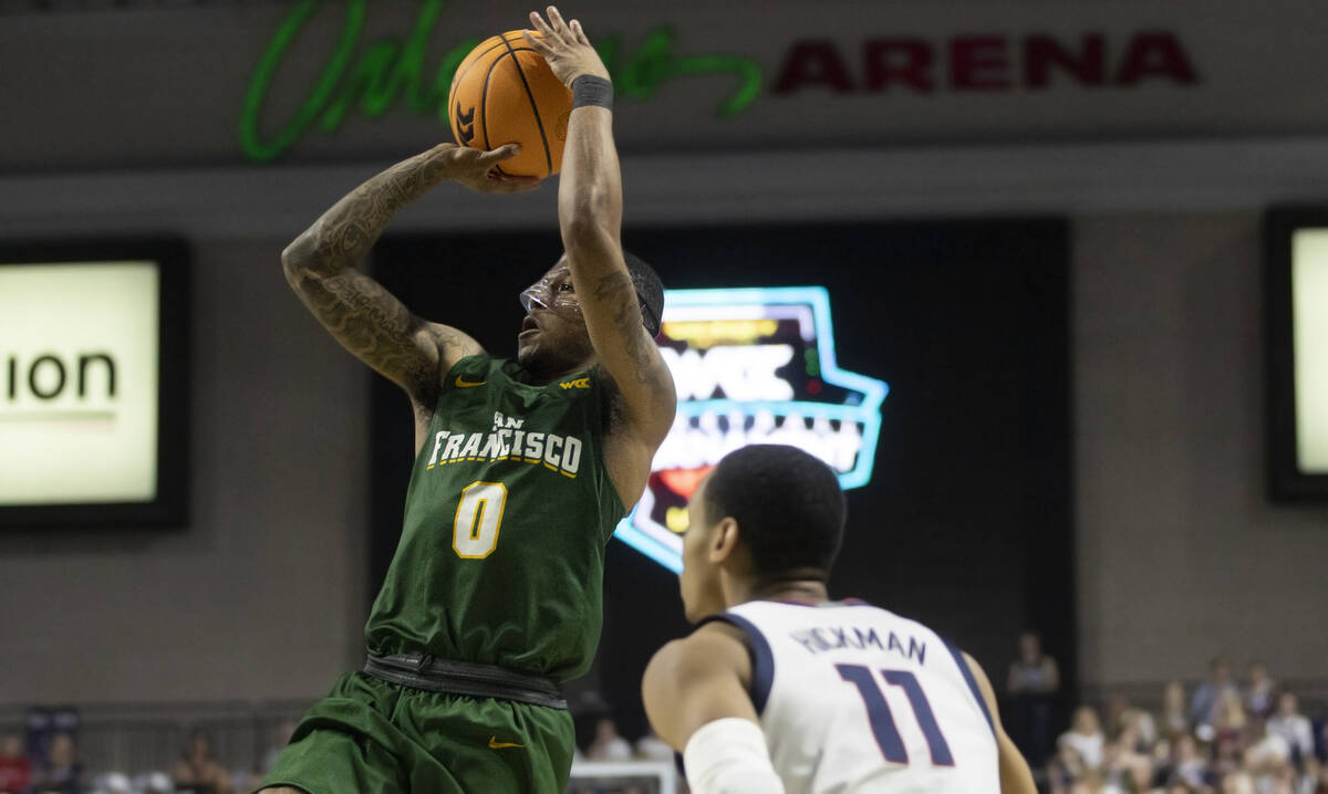 San Francisco Dons guard Khalil Shabazz (0) shoots over Gonzaga Bulldogs guard Nolan Hickman (1 ...