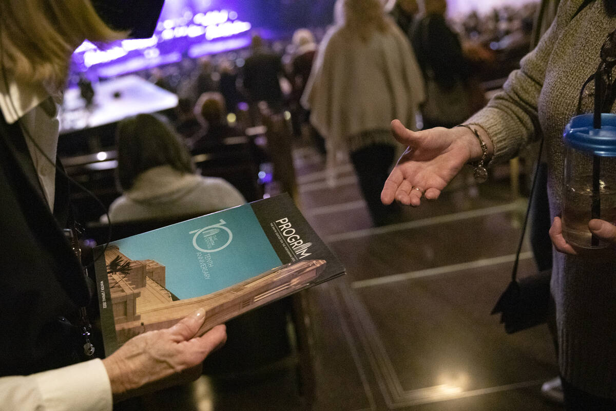 Programs are handed to guests ahead of Paul Anka’s performance during the 10th anniversa ...