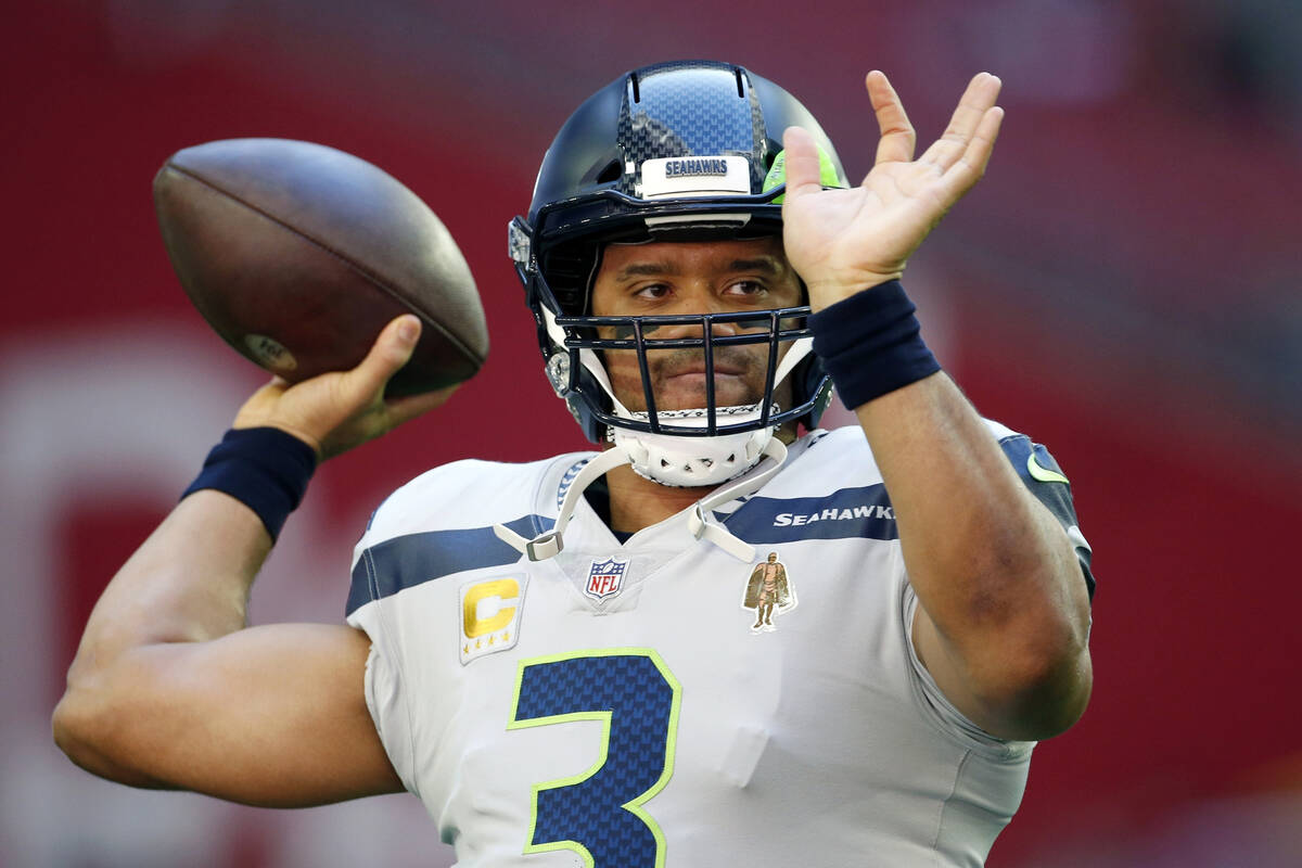 FILE - Seattle Seahawks quarterback Russell Wilson warms up prior to an NFL football game again ...