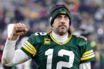 Green Bay Packers quarterback Aaron Rodgers (12) reacts as he leaves the field after an NFL gam ...