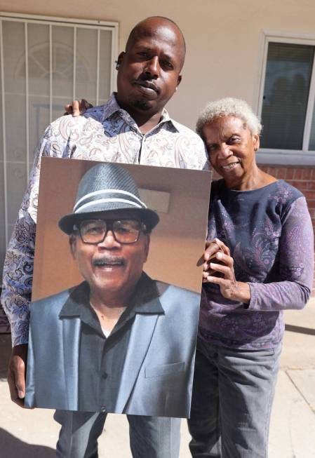 David Biddle Jr.’s sister Aletha Halcomb and nephew Leroy Brice hold his photo Tuesday, ...