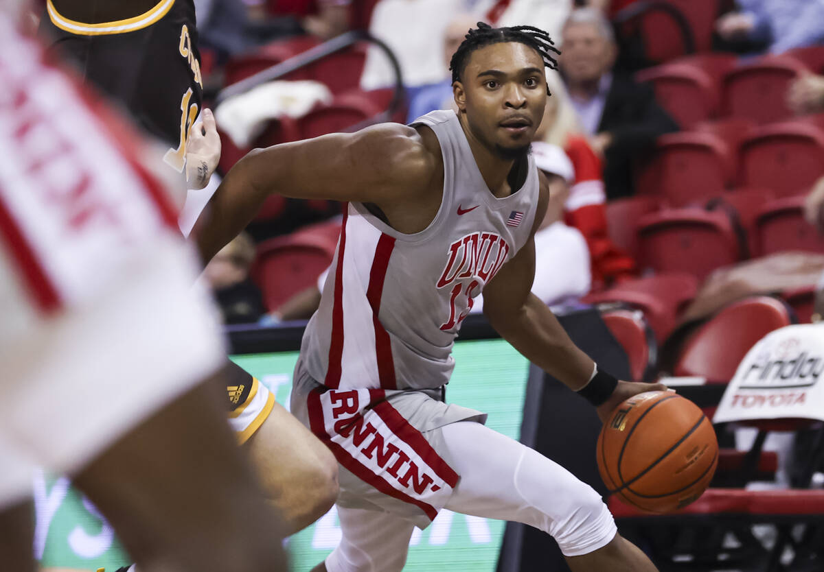 UNLV Rebels guard Bryce Hamilton (13) drives to the basket against the Wyoming Cowboys during t ...