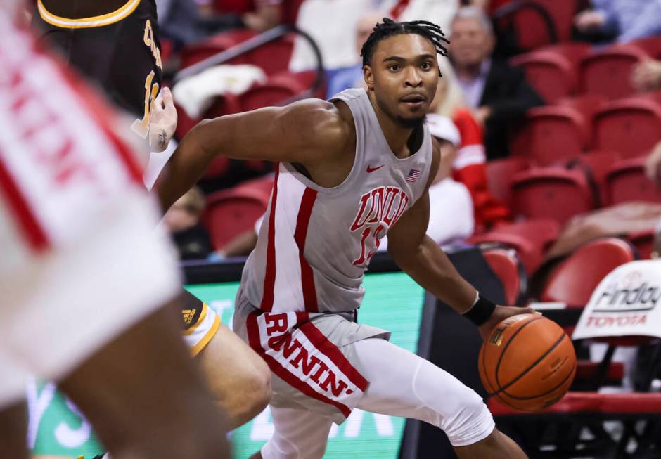 UNLV Rebels guard Bryce Hamilton (13) drives to the basket against the Wyoming Cowboys during t ...