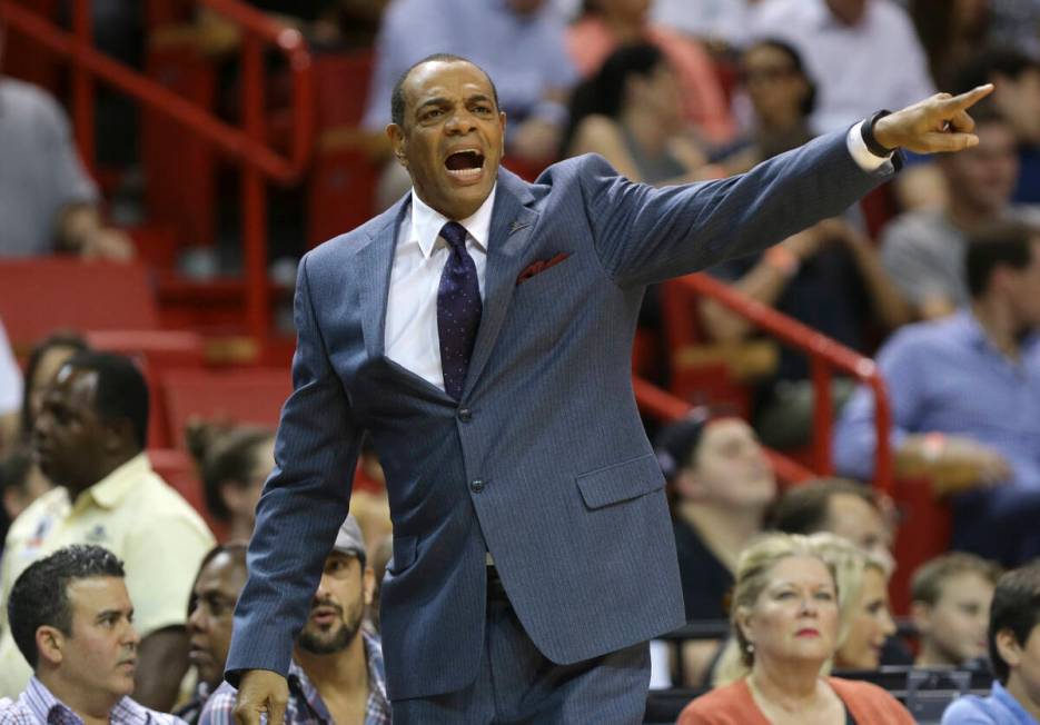 Brooklyn Nets head coach Lionel Hollins calls out during the first half of an NBA basketball ga ...