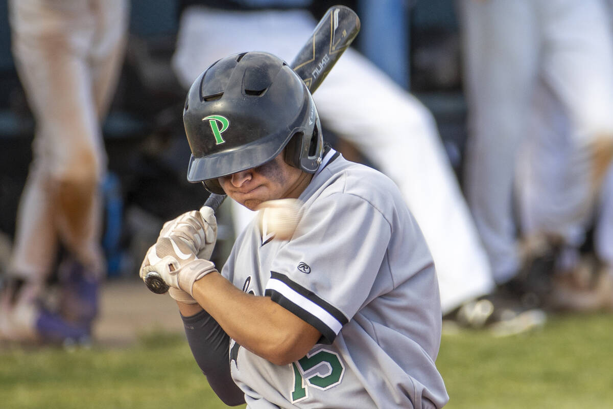 Palo Verde hitter Jason Schaaf (15) is brushed back by a pitch versus Basic during an NIAA base ...