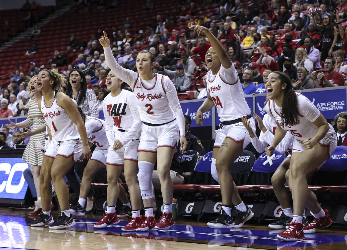 The UNLV Lady Rebels cheer during the second half of a semifinal Mountain West tournament baske ...