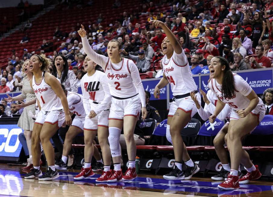 The UNLV Lady Rebels cheer during the second half of a semifinal Mountain West tournament baske ...