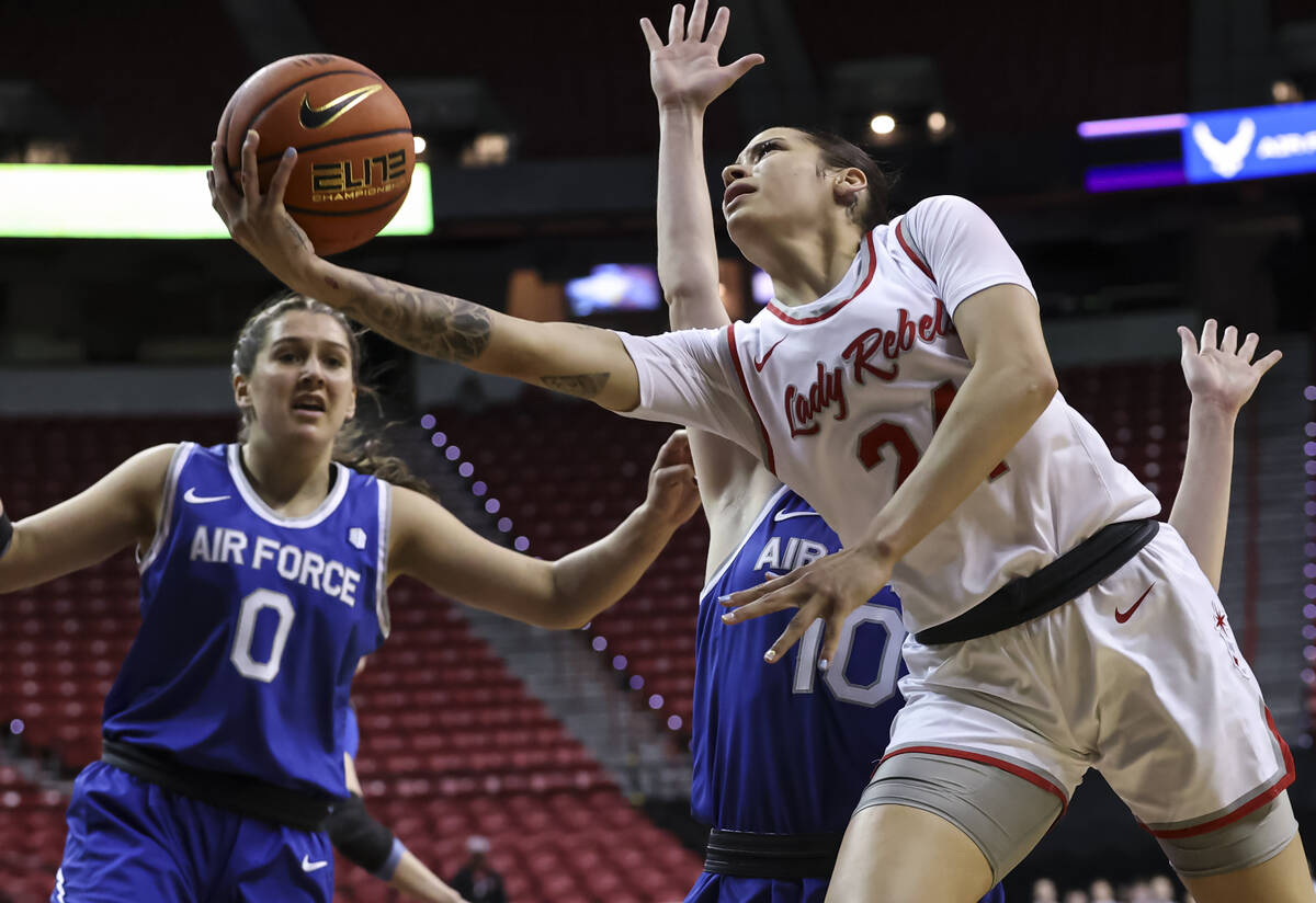 UNLV Lady Rebels guard Essence Booker (24) lays up the ball in front of Air Force Falcons forwa ...
