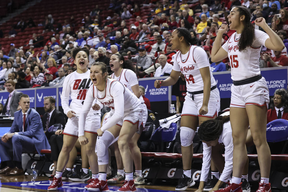 The UNLV Lady Rebels cheer during the second half of a semifinal Mountain West tournament baske ...