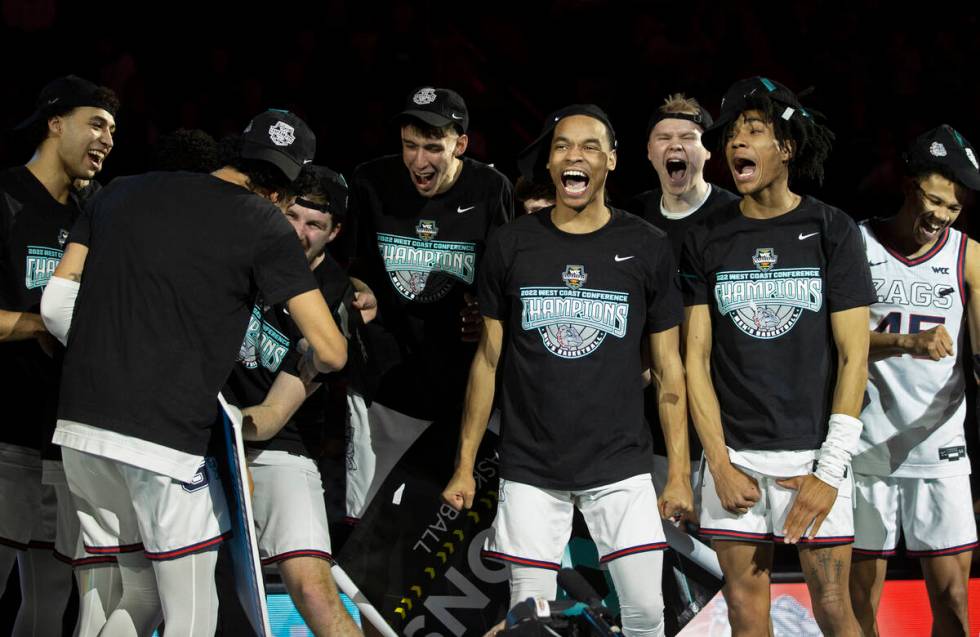 Gonzaga players celebrate after beating St. Mary’s to win the West Coast Conference tour ...