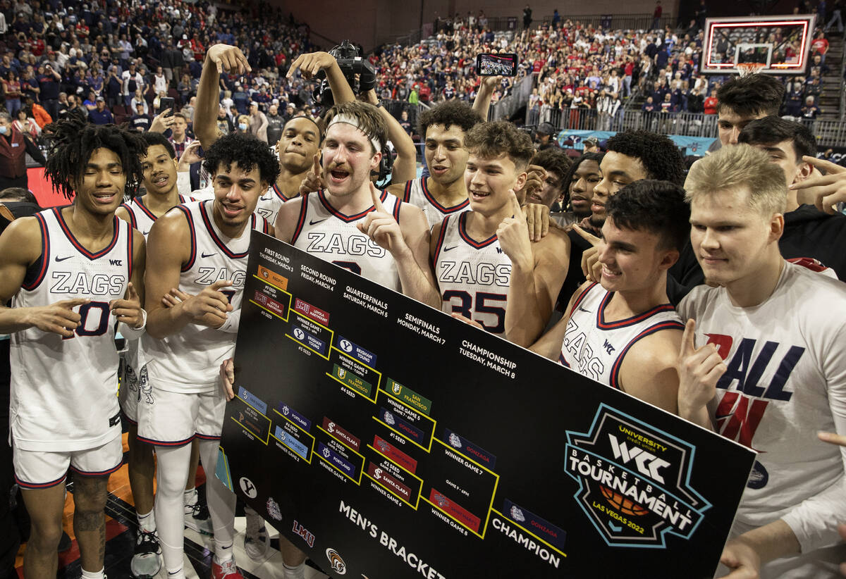 Gonzaga players celebrate after beating St. Mary’s to win the West Coast Conference tour ...