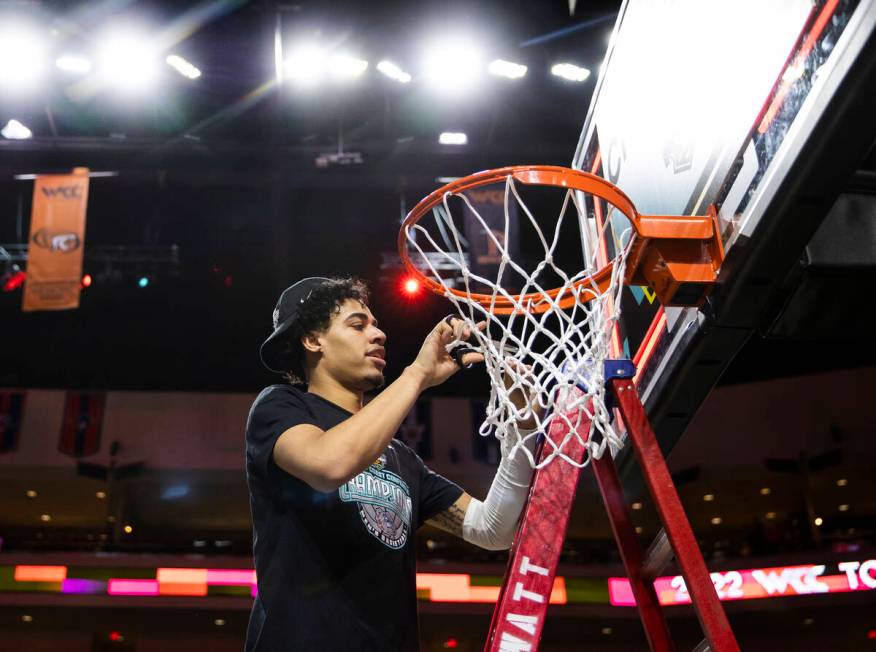 Las Vegas native and Gonzaga Bulldogs guard Julian Strawther cuts down the net after beating St ...