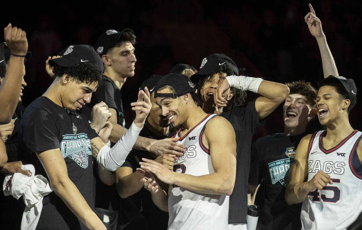 Gonzaga players celebrate after beating St. Mary’s to win the West Coast Conference tour ...