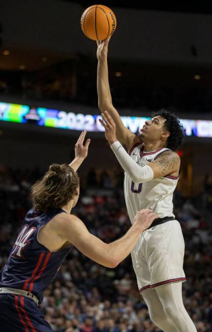 Gonzaga Bulldogs guard Julian Strawther (0) shoots over St. Mary's Gaels guard Alex Ducas (44) ...