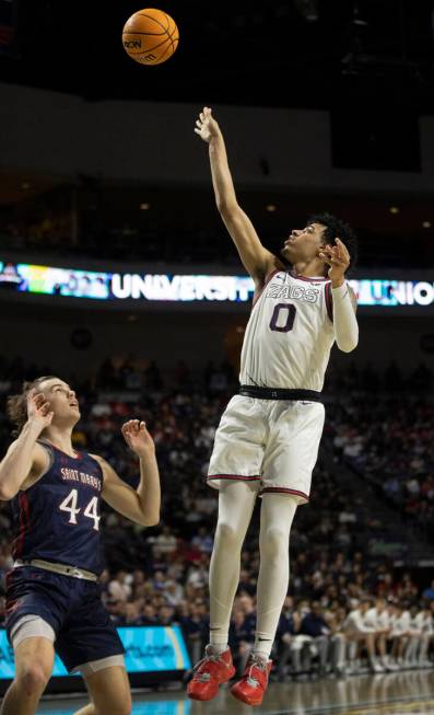 Gonzaga Bulldogs guard Julian Strawther (0) shoots over St. Mary's Gaels guard Alex Ducas (44) ...