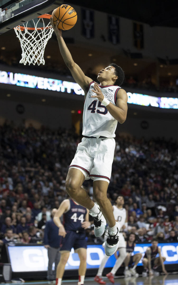 Gonzaga Bulldogs guard Rasir Bolton (45) slices to the rim past St. Mary's Gaels guard Alex Duc ...