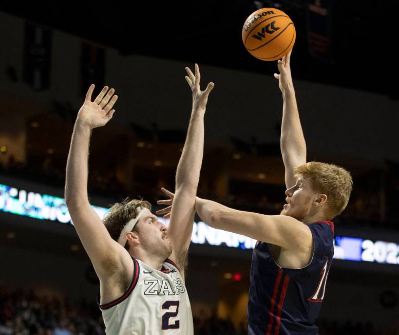 St. Mary's Gaels forward Matthias Tass (11) shoots over Gonzaga Bulldogs forward Drew Timme (2) ...