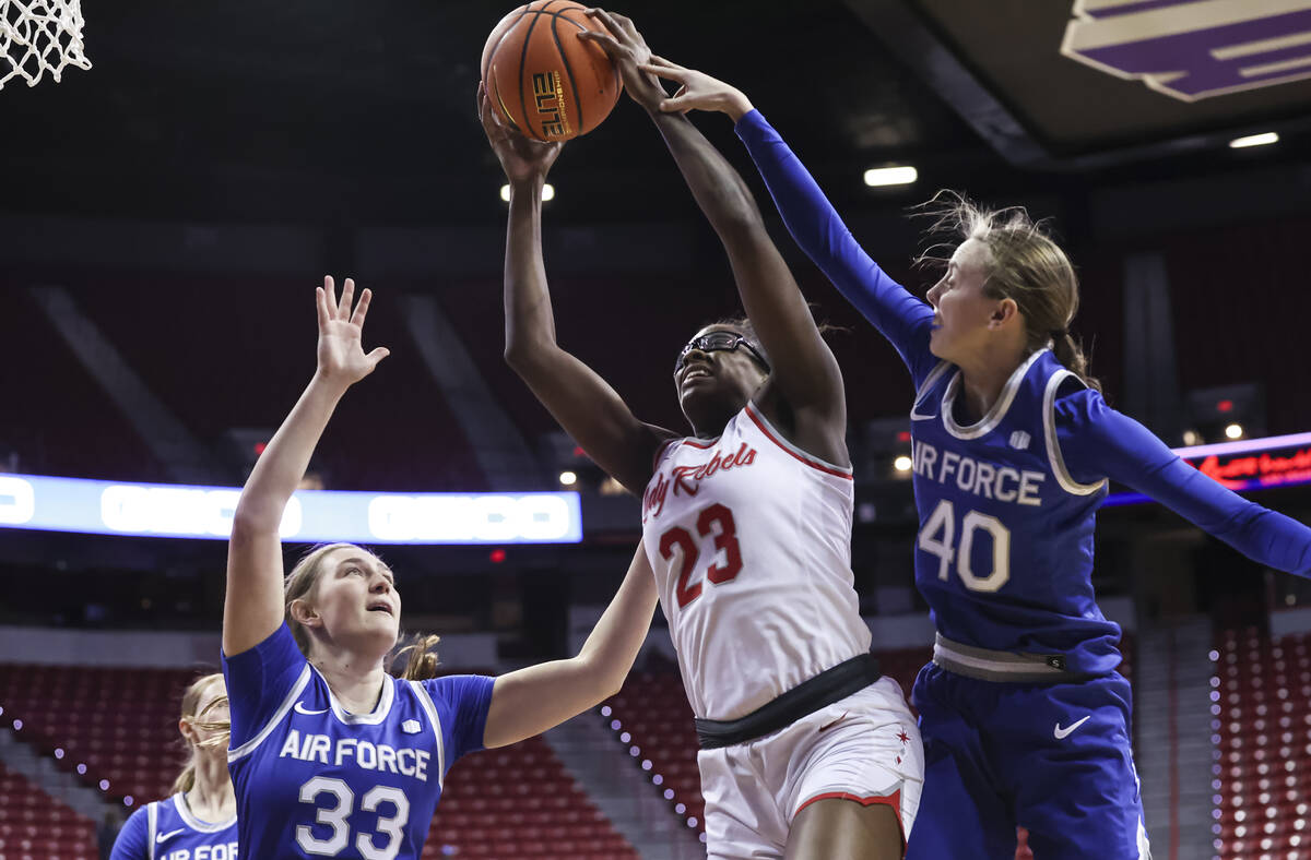 UNLV Lady Rebels center Desi-Rae Young (23) grabs a rebound between Air Force Falcons forward N ...