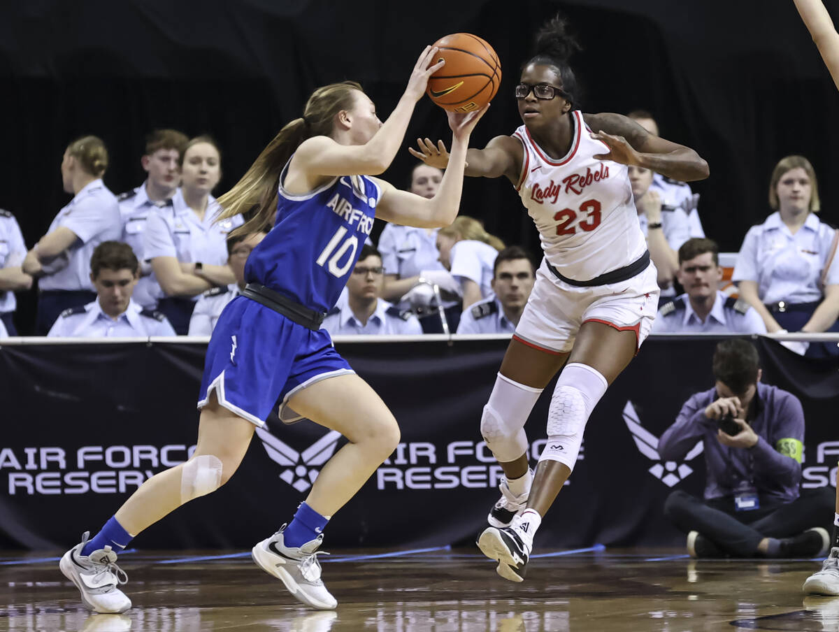 Air Force Falcons guard Kamri Heath (10) drives the ball as UNLV Lady Rebels center Desi-Rae Yo ...