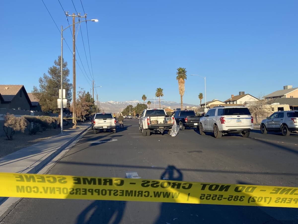 Las Vegas police investigate a fatal crash at the intersection of Gowan and Walnut roads in the ...