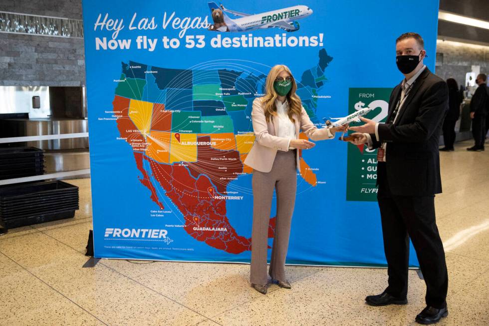 Frontier Airlines Vice President of Marketing Tyri Squyres, left, and Harry Reid International ...