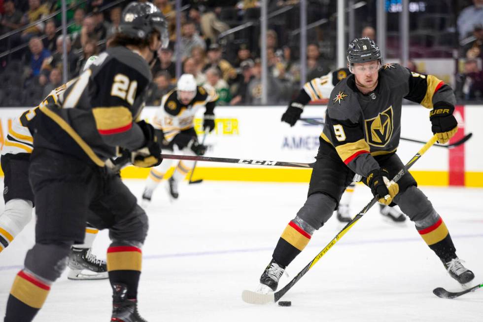 Golden Knights center Jack Eichel (9) looks to pass while center Chandler Stephenson (20) skate ...