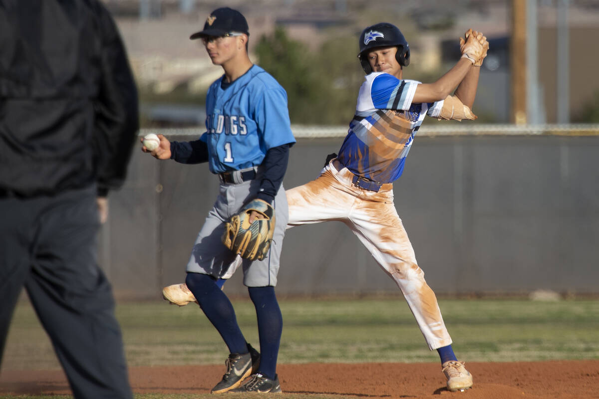 Basic’s Tate Southisene celebrates after successfully sliding into second base while Cen ...