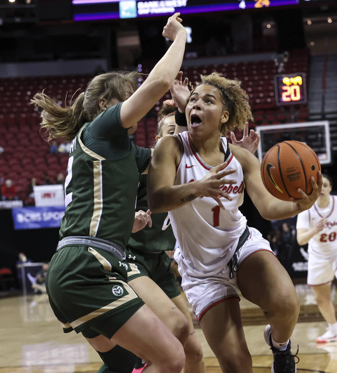 UNLV Lady Rebels forward Nneka Obiazor (1) lays up the ball against Colorado State Rams forward ...