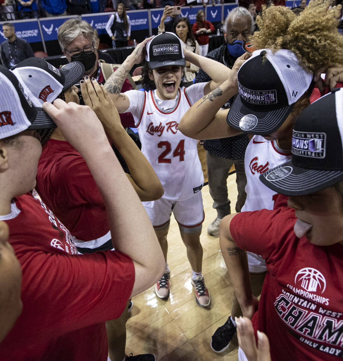 UNLV Lady Rebels guard Essence Booker (24) celebrates with teammates after defeating the Colora ...