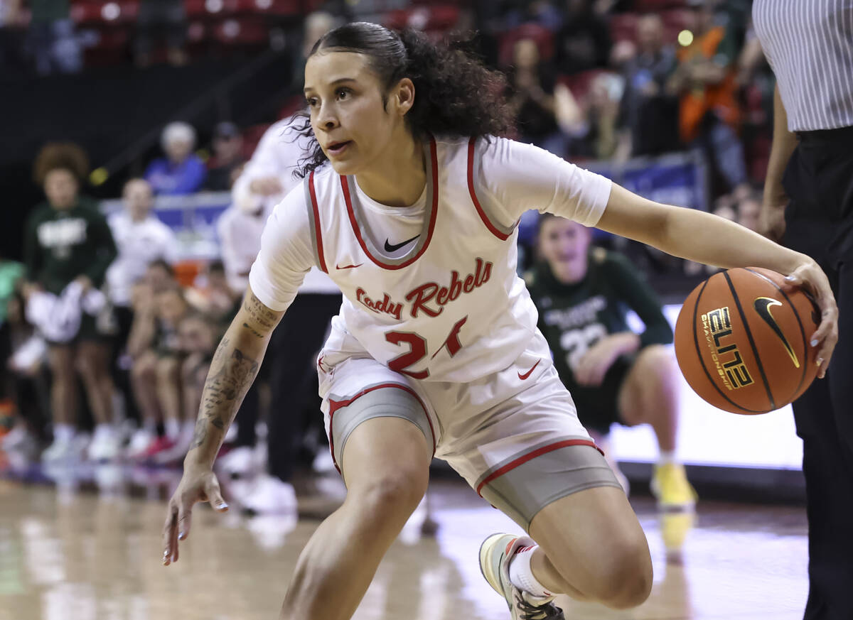 UNLV Lady Rebels guard Essence Booker (24) drives the ball against Colorado State Rams during t ...