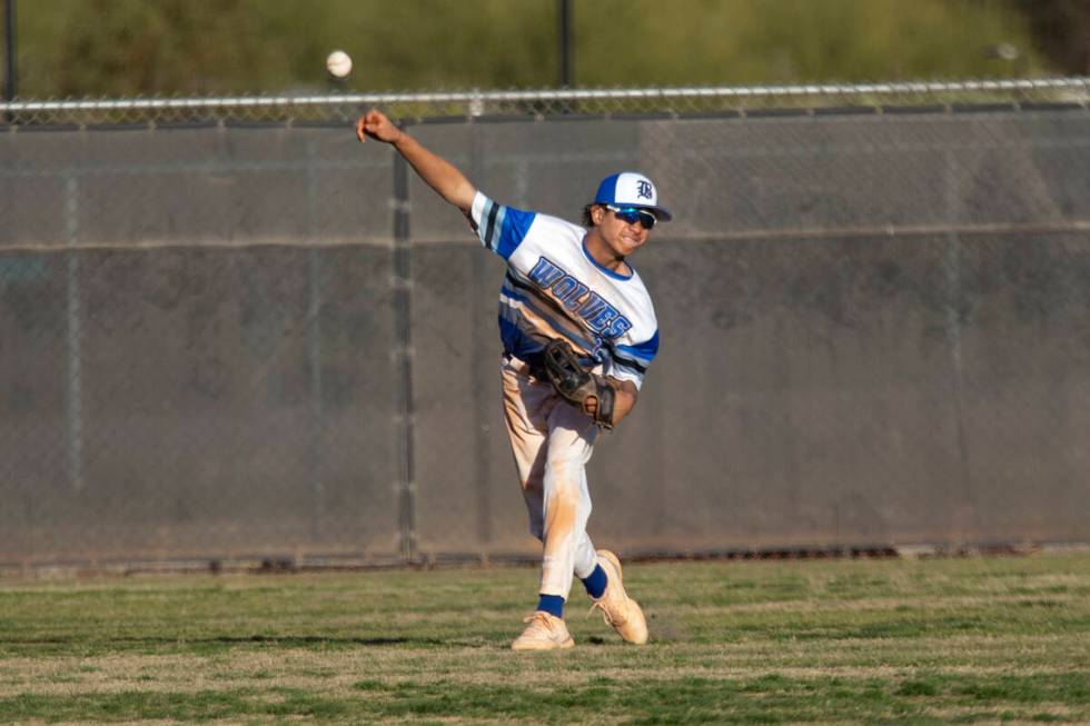 Basic’s Tate Southisene throws in from the outfield during a high school baseball game a ...