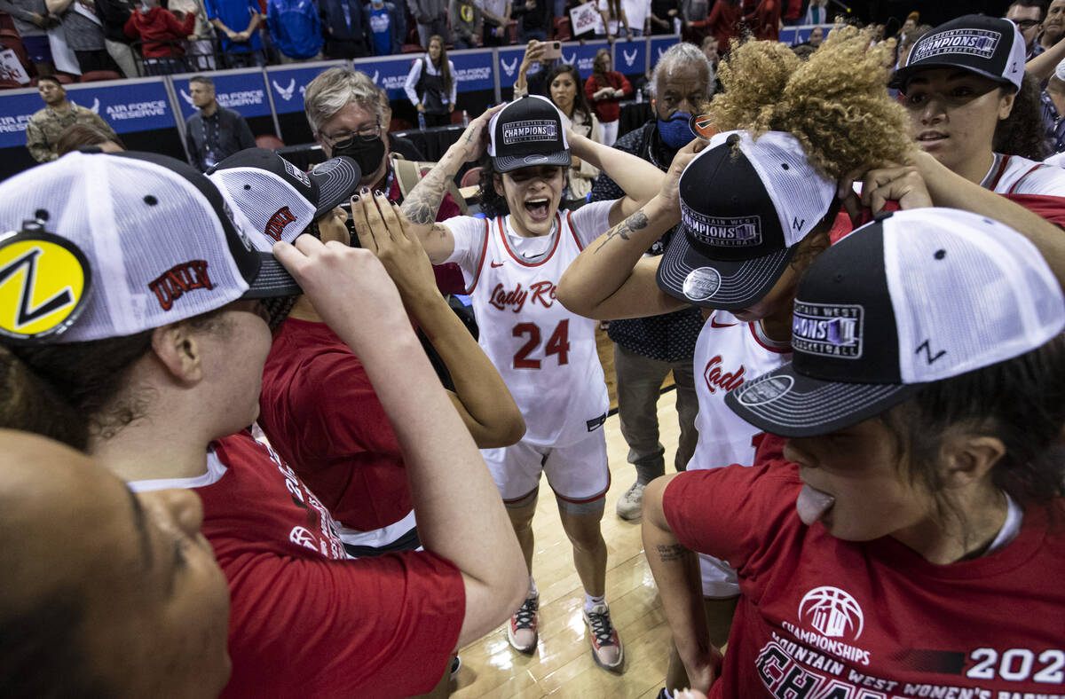 UNLV Lady Rebels guard Essence Booker (24) celebrates with teammates after defeating the Colora ...