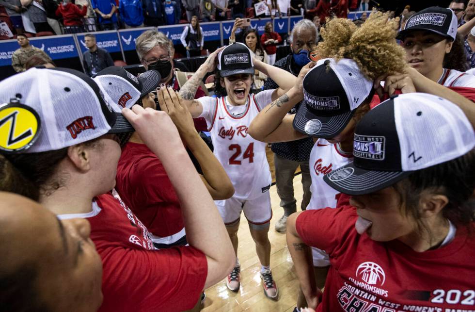 UNLV Lady Rebels guard Essence Booker (24) celebrates with teammates after defeating the Colora ...