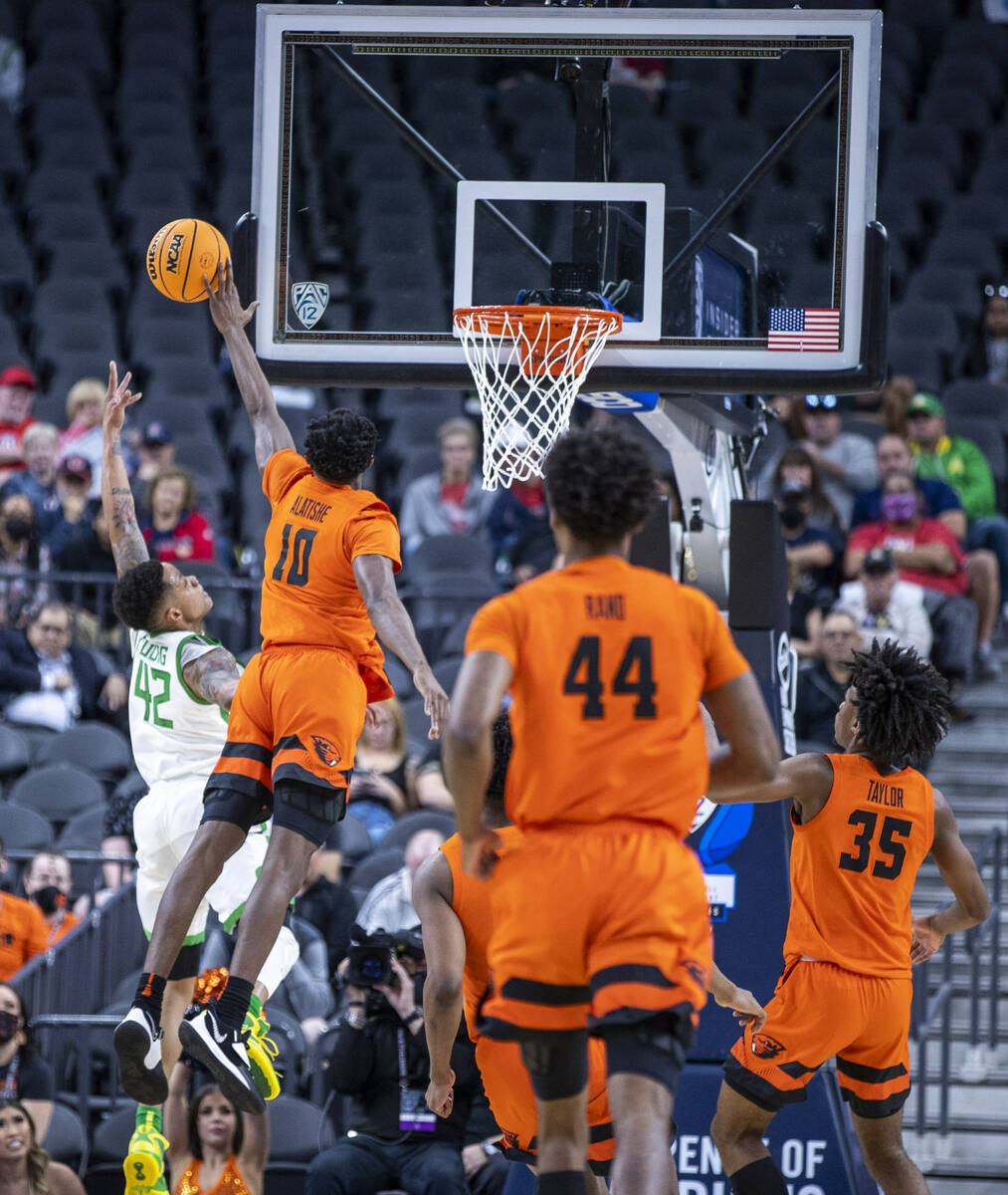 Oregon Ducks guard Jacob Young (42) has a shot blocked by Oregon State Beavers forward Warith A ...