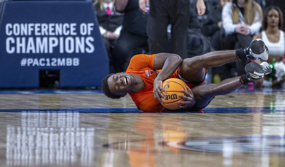 Oregon State Beavers guard Dashawn Davis (13) goes down hard after an Oregon Ducks foul during ...