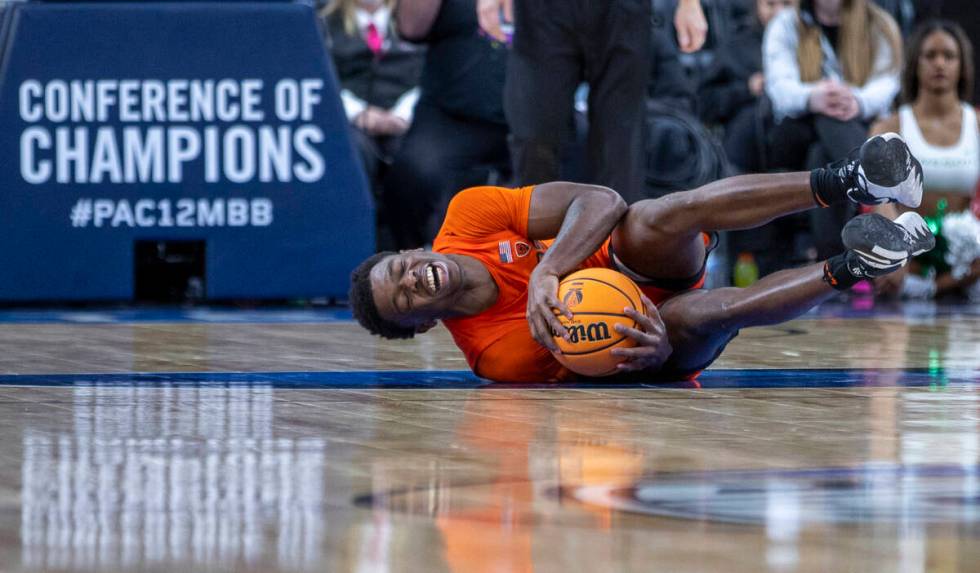 Oregon State Beavers guard Dashawn Davis (13) goes down hard after an Oregon Ducks foul during ...