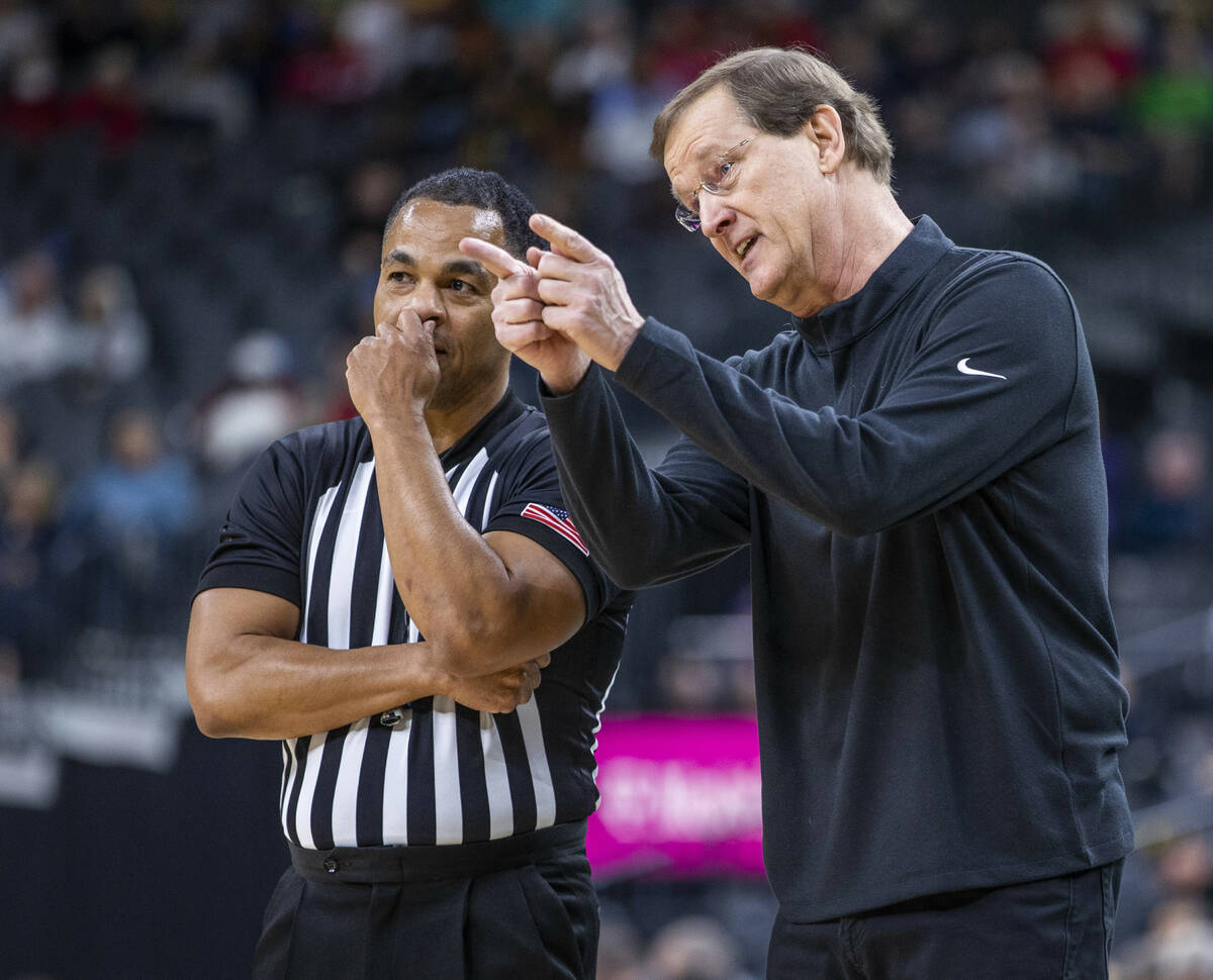 Oregon Ducks head coach Dana Altman argues a foul call with an official versus the Oregon State ...