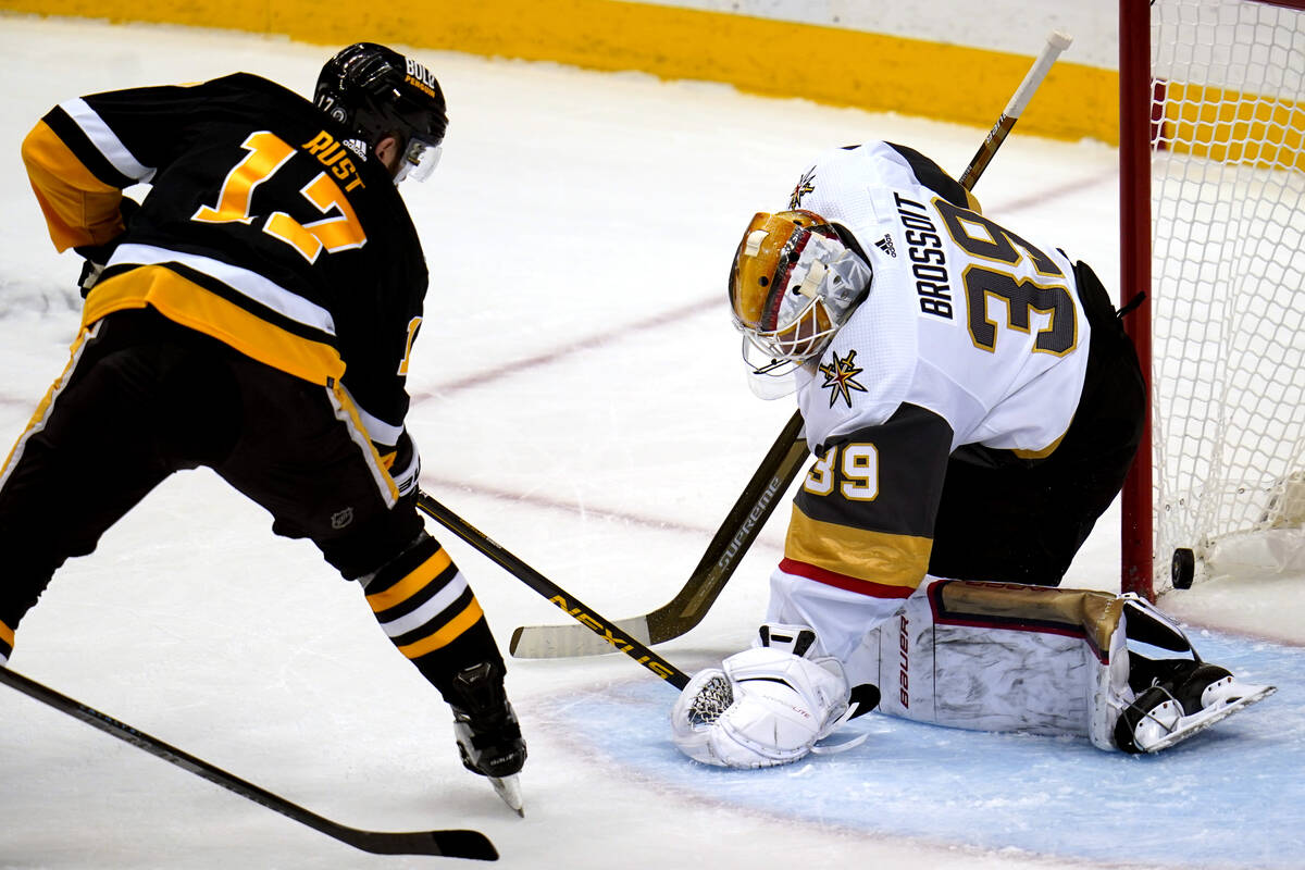 Vegas Golden Knights goaltender Laurent Brossoit (39) blocks a shot by Pittsburgh Penguins' Bry ...