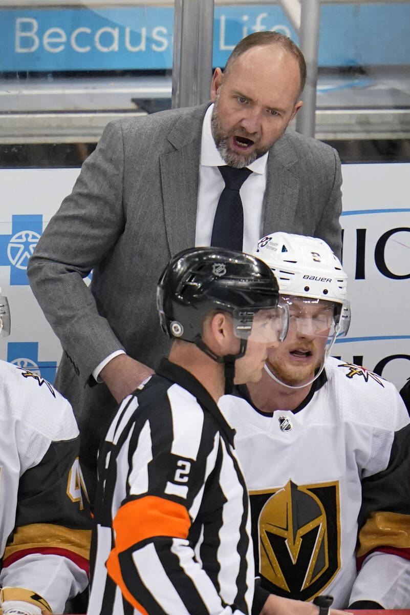 Vegas Golden Knights head coach Peter DeBoer has a work with referee Jon McIsaac (2) during the ...