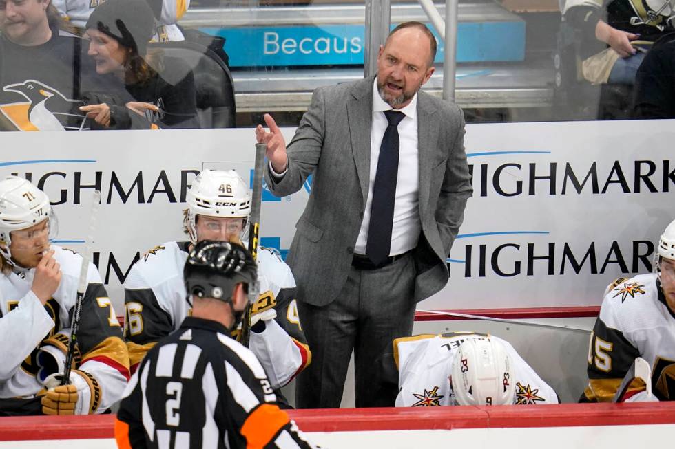 Vegas Golden Knights head coach Peter DeBoer has a work with referee Jon McIsaac (2) during the ...