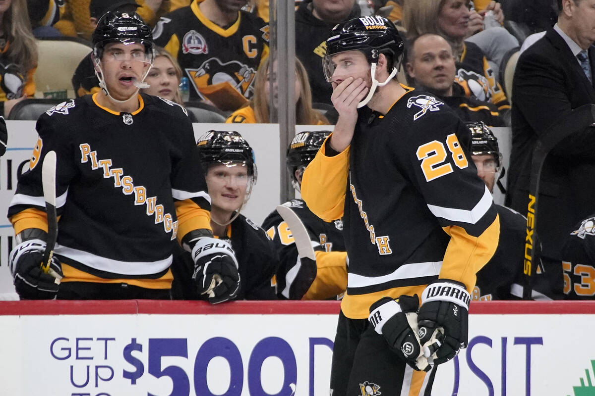 Pittsburgh Penguins' Marcus Pettersson (28) skates off the ice after being hit by the puck whil ...