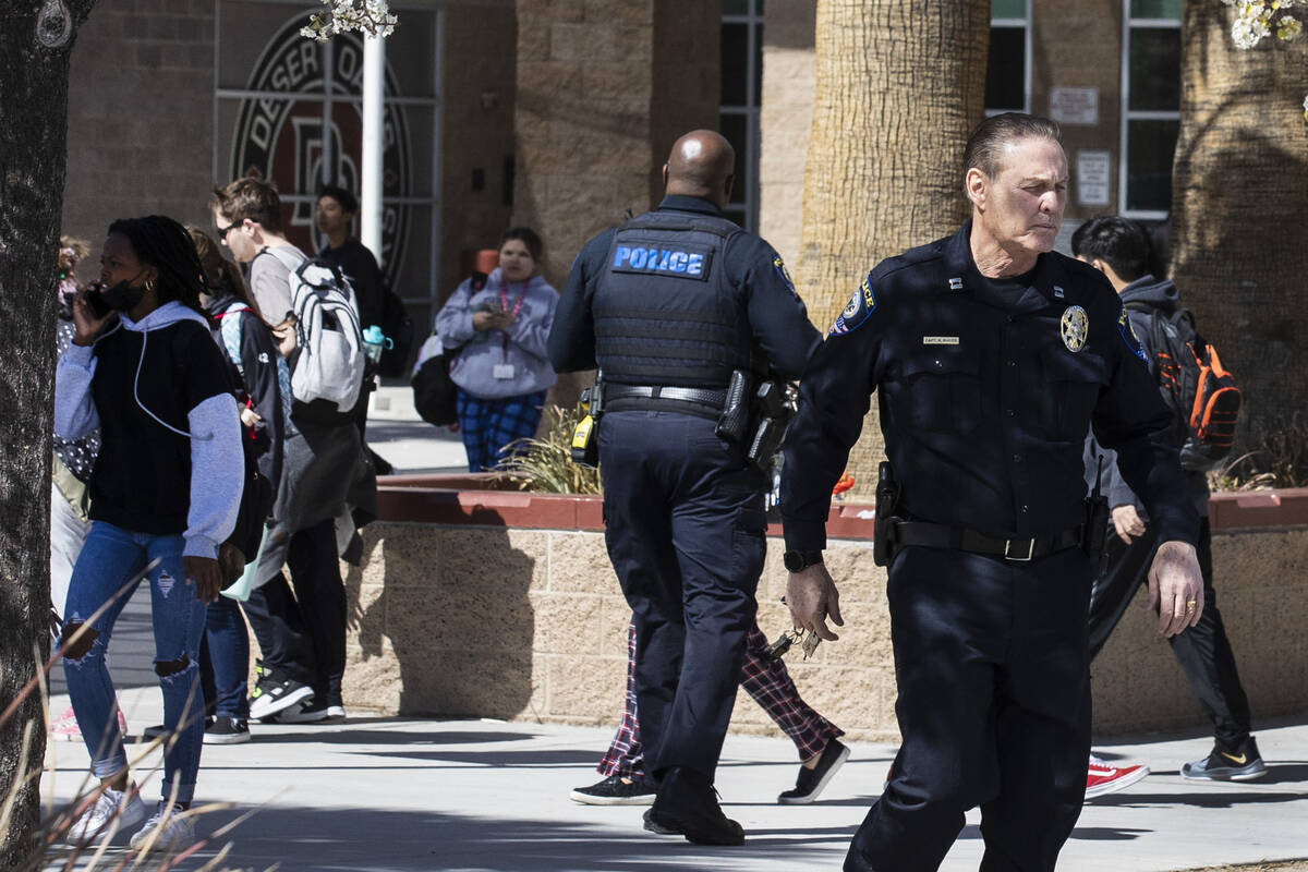 The Clark County School district police are seen as students at Desert Oasis leave their school ...