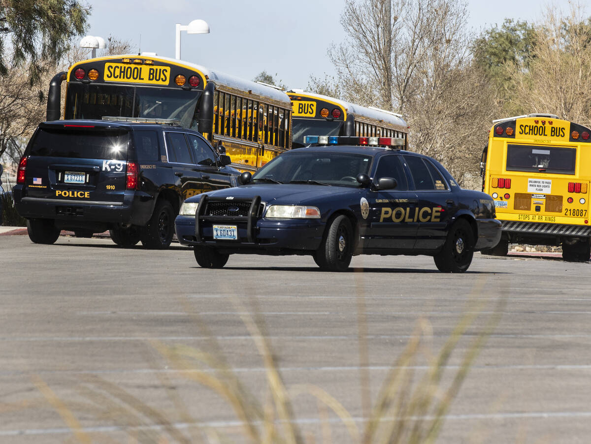 The Clark County School district police vehicles are seen as students at Desert Oasis leave the ...