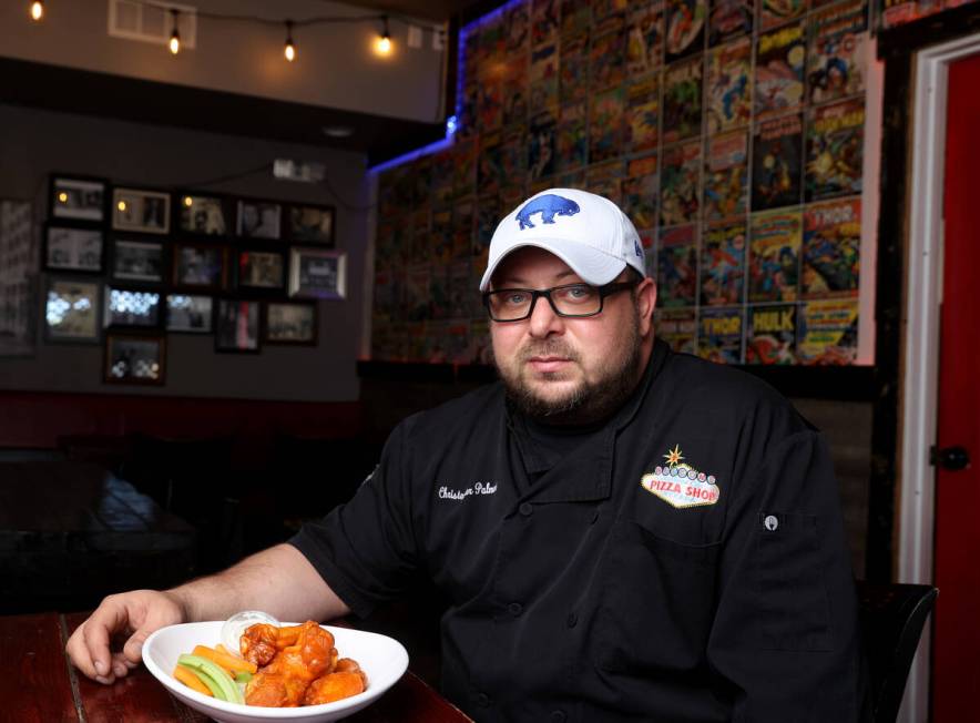 Naked City Pizza owner Chris Palmeri with his signature chicken wings at his Paradise Road loca ...