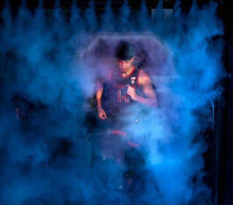 Stanford Cardinal forward Spencer Jones (14) emerges from the smoke as he’s introduced to pla ...