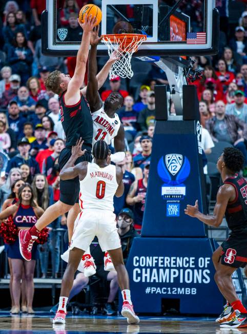 Stanford Cardinal forward James Keefe (22) goes up strong to the net defended by Arizona Wildca ...