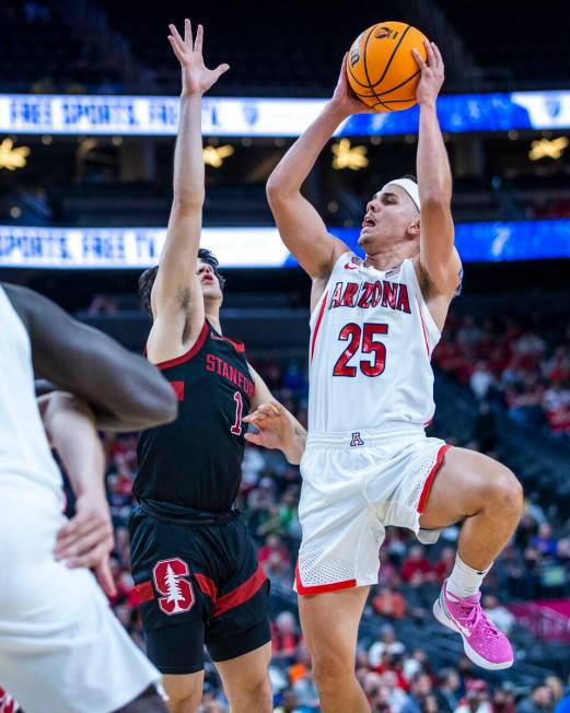 Arizona Wildcats guard Kerr Kriisa (25) elevates for a shot past Stanford Cardinal guard Isa Si ...