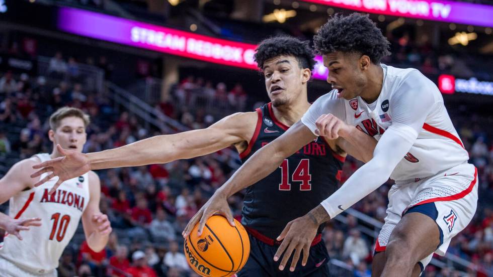 Stanford Cardinal forward Spencer Jones (14) fouls Arizona Wildcats guard Justin Kier (5) as he ...