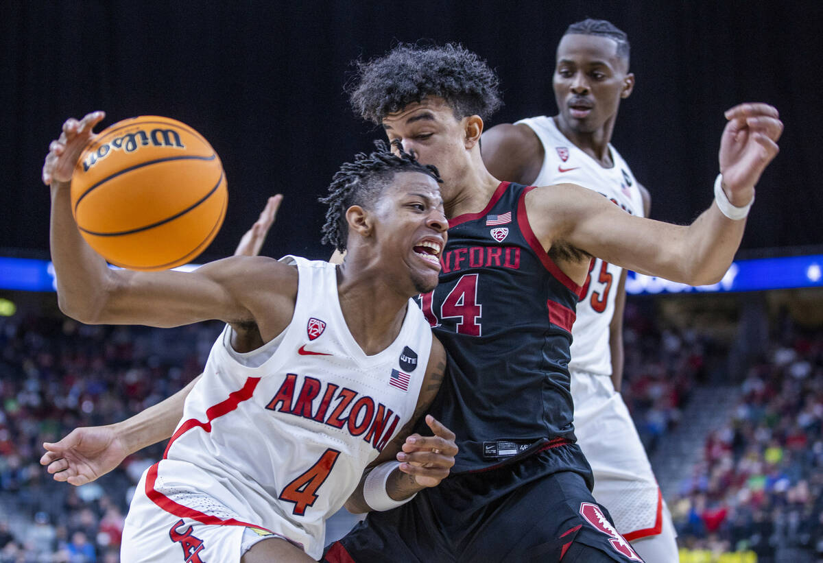 Arizona Wildcats guard Dalen Terry (4) drives inside of Stanford Cardinal forward Spencer Jones ...